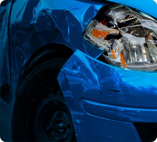 Blue vehicle with collision damage to the front corner
