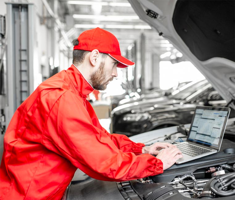 Technician reviewing a vehicle during service